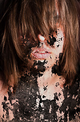 Image showing Dark art portrait of a girl with cracks and old paint