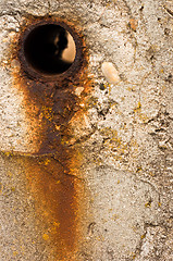 Image showing Rusty hole in concrete wall