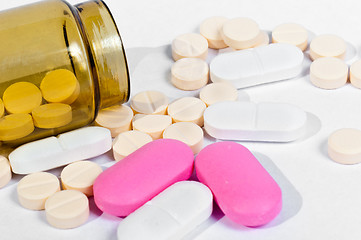 Image showing Medicine bottle with pills on white isolated background