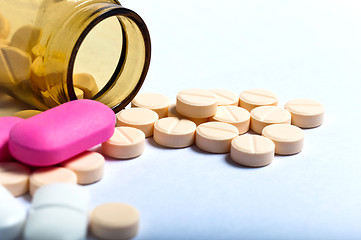 Image showing Medicine bottle against white isolated background with pills