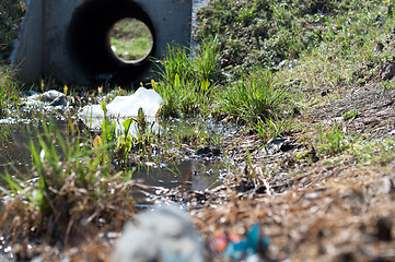 Image showing Sewage drainage system with water and grass