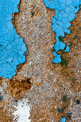 Image showing An abandoned wooden background with some blue paint