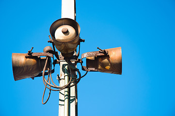 Image showing Rusty speakers against blue background