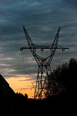 Image showing Silhouette of power cables against sunset