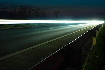 Image showing White light on road at night