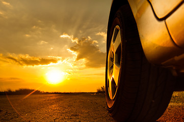 Image showing Close up shot of a car against sunset in the background