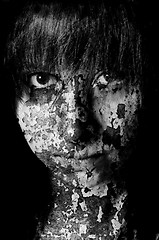 Image showing Dark art portrait of a girl with cracks and old paint in black a