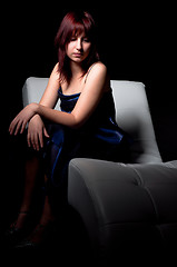 Image showing beautiful fashion woman in blue dress sitting