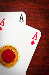 Image showing A pair of aces on wooden background