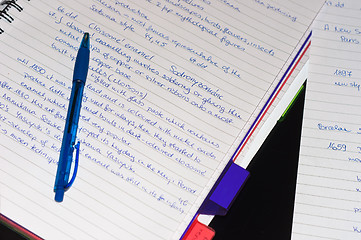 Image showing Notebook with a blue pen and text on it