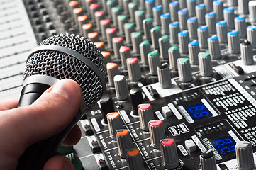 Image showing Sound mixer with microphone and hand