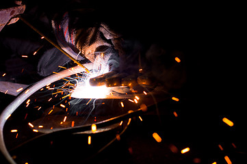 Image showing Welding plates togather with sparks