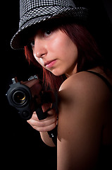Image showing Girl pointong pistol. Dont mess with girls