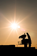 Image showing Silhouette of an old radar against sunset