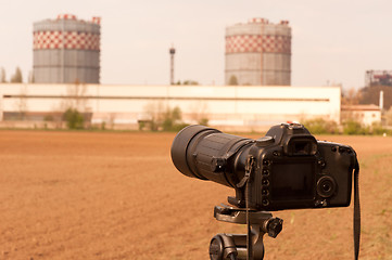 Image showing Camera zooming on liquid cooling towers to inspect them