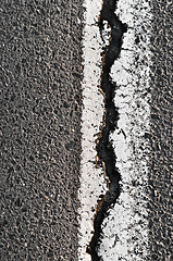 Image showing Cracked Asphalt Road Surface With Line