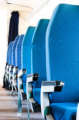 Image showing Blue seats of an Airplane with blurry background