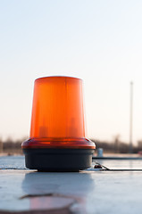 Image showing An orange siren on a top of a car