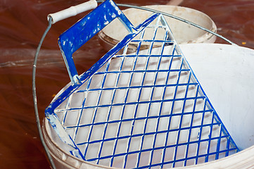 Image showing Paint bucket with painting accessorie