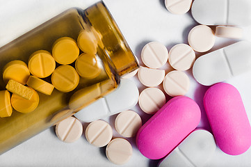 Image showing Medicine bottle with pills against white background