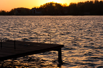 Image showing A pier on the shore with sunset