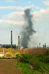 Image showing black smoke rises from power plant