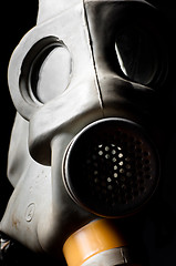 Image showing A gasmask with partial light