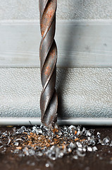 Image showing Closeup of a rusty drill-bit with burr under it