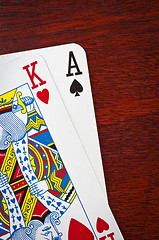 Image showing A king and an ace on wooden background