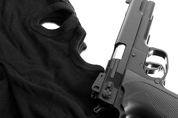 Image showing Pistol and mask of a thief over white