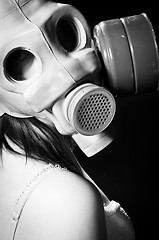 Image showing Girl wearing gasmask and white lingerie in black and white