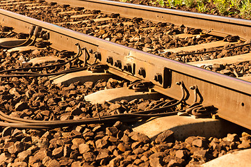 Image showing rusty old railway with cables