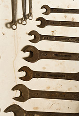 Image showing Many spanners on white board