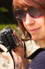 Image showing Girl with camera in warm tones