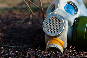 Image showing Protective gasmask in the middle of a disaster