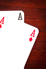 Image showing A pair of aces on wooden background