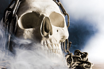 Image showing human skull with chain and smoke