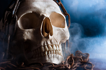 Image showing human skull with chain and smoke