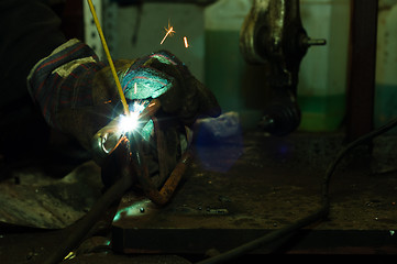 Image showing Welding in industrial enviroment with white sparks