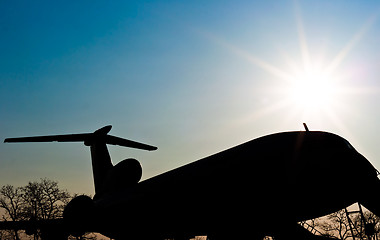 Image showing Silhouette of a landed airplane