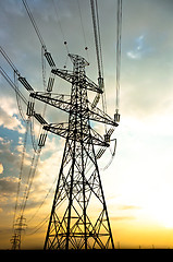 Image showing Electric lines leading into sunset