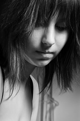 Image showing Beautiful young girl looking depressed in black and white