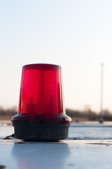 Image showing A red siren on a top of a car