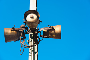 Image showing Rusty speakers against blue background