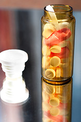 Image showing Opened medicine bottle with reflection