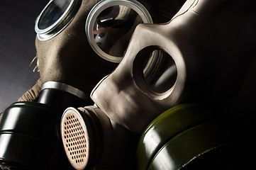 Image showing Closeup of a gasmask with enlighted background