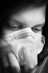 Image showing Girl wearing protective mask in black and white