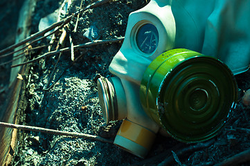 Image showing Vintage gasmask on burnt down ground