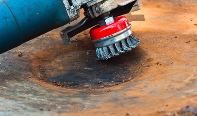 Image showing wire brush for cleaning rust off metal surface