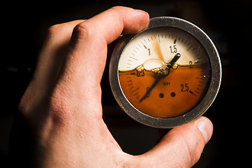 Image showing Gas meter in a hands of a man